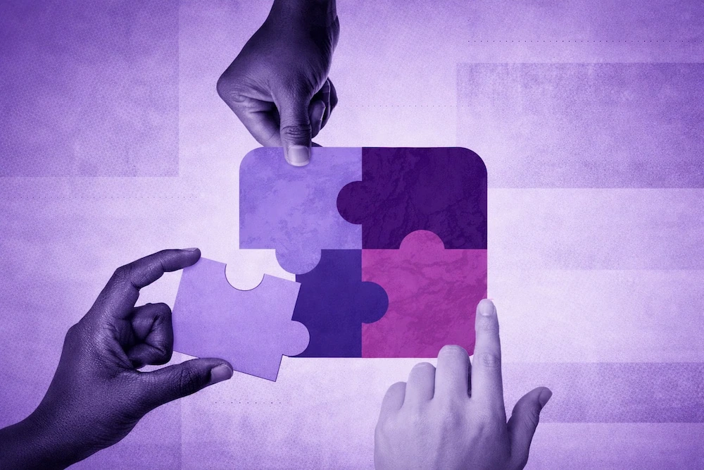 hands-connecting-puzzle-pieces-representing-brand-strategy
